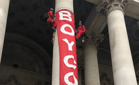  Activists scale Royal Exchange to launch “Boycott Bloody Insurance” Campaign