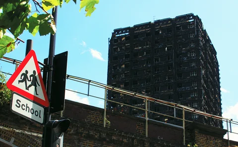Grenfell building and school sign_for CMS