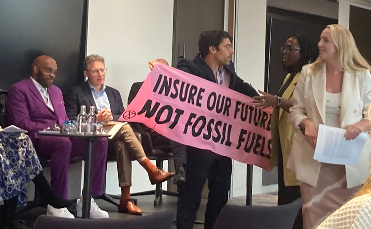 A protester at Howden’s Dive In 2025 event