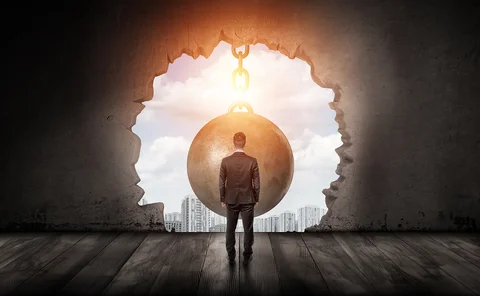 Businessman, wrecking ball and city