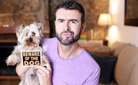 Man and new pet dog - Beware of The Dog sign
